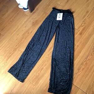 Animal print black legging with flare bottoms.